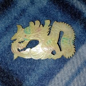 Very vintage red eyed mother of pearl brooch